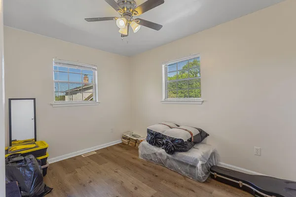 a bed room with a bed and a window