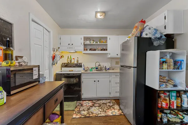 a view of a dining room with furniture and window