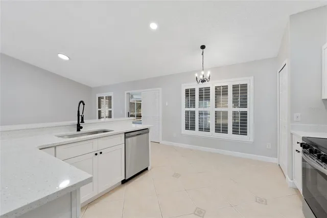 a spacious bedroom with a large bed and a window