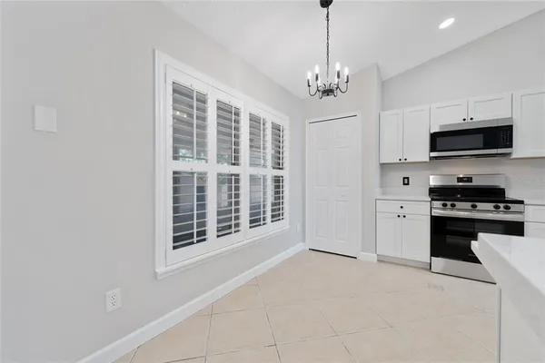 a kitchen with stainless steel appliances granite countertop a stove and a refrigerator