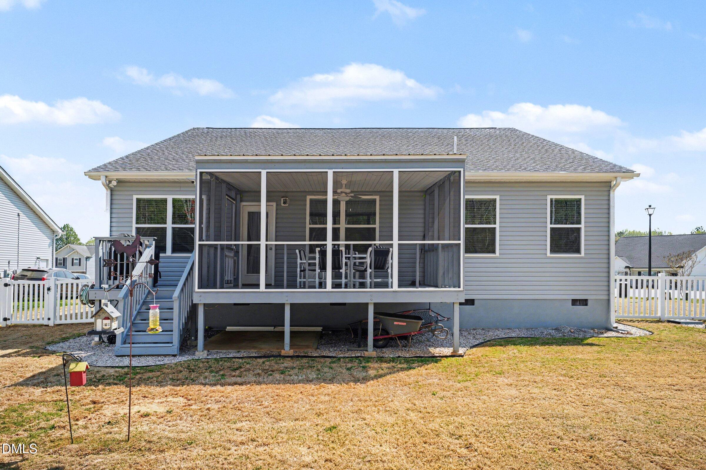 130 Aylebury Ridge Zebulon, NC 27597 - Photo 26 of 41 a view of a house with wooden walls and floor to ceiling windows
