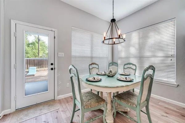 a dining room with furniture and window