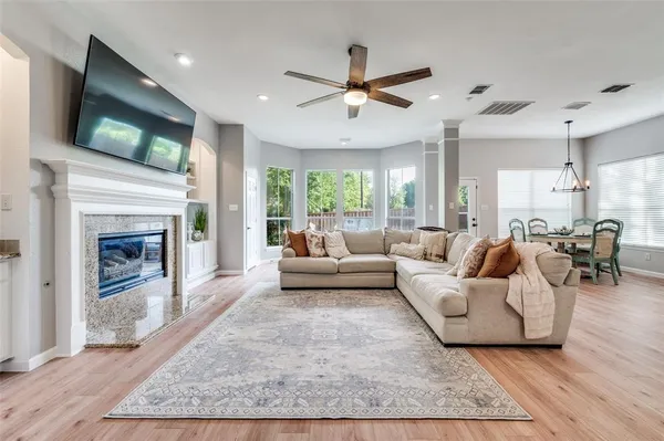 a living room with furniture and a fireplace