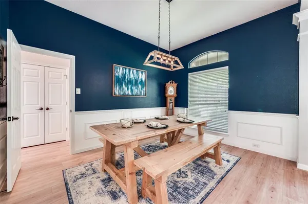 a very nice looking dining room with a table and chairs