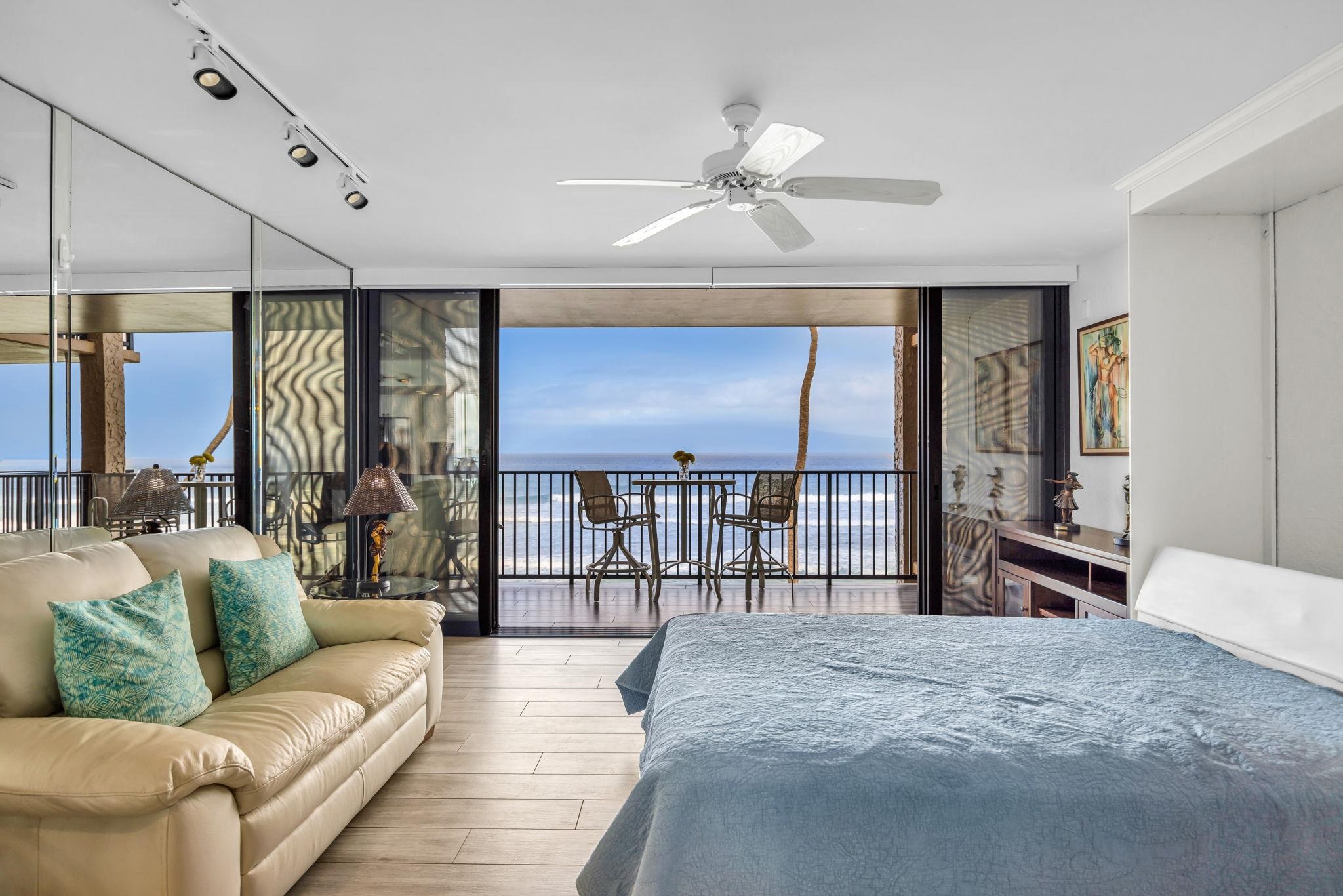 3543 Lower Honoapiilani Road, Unit F303 Lahaina, HI 96761 - Photo 12 of 20 a living room with furniture and a large window