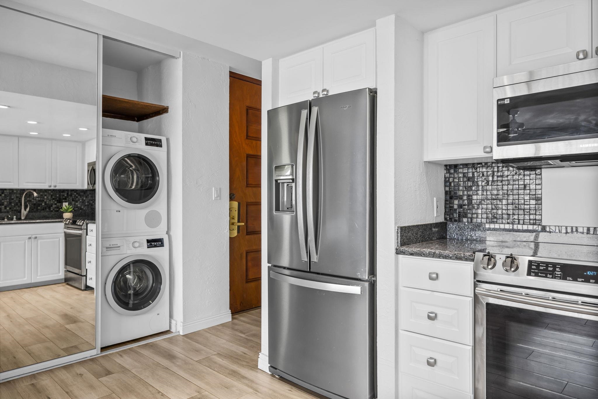 3543 Lower Honoapiilani Road, Unit F303 Lahaina, HI 96761 - Photo 15 of 20 a kitchen with refrigerator a washer and dryer