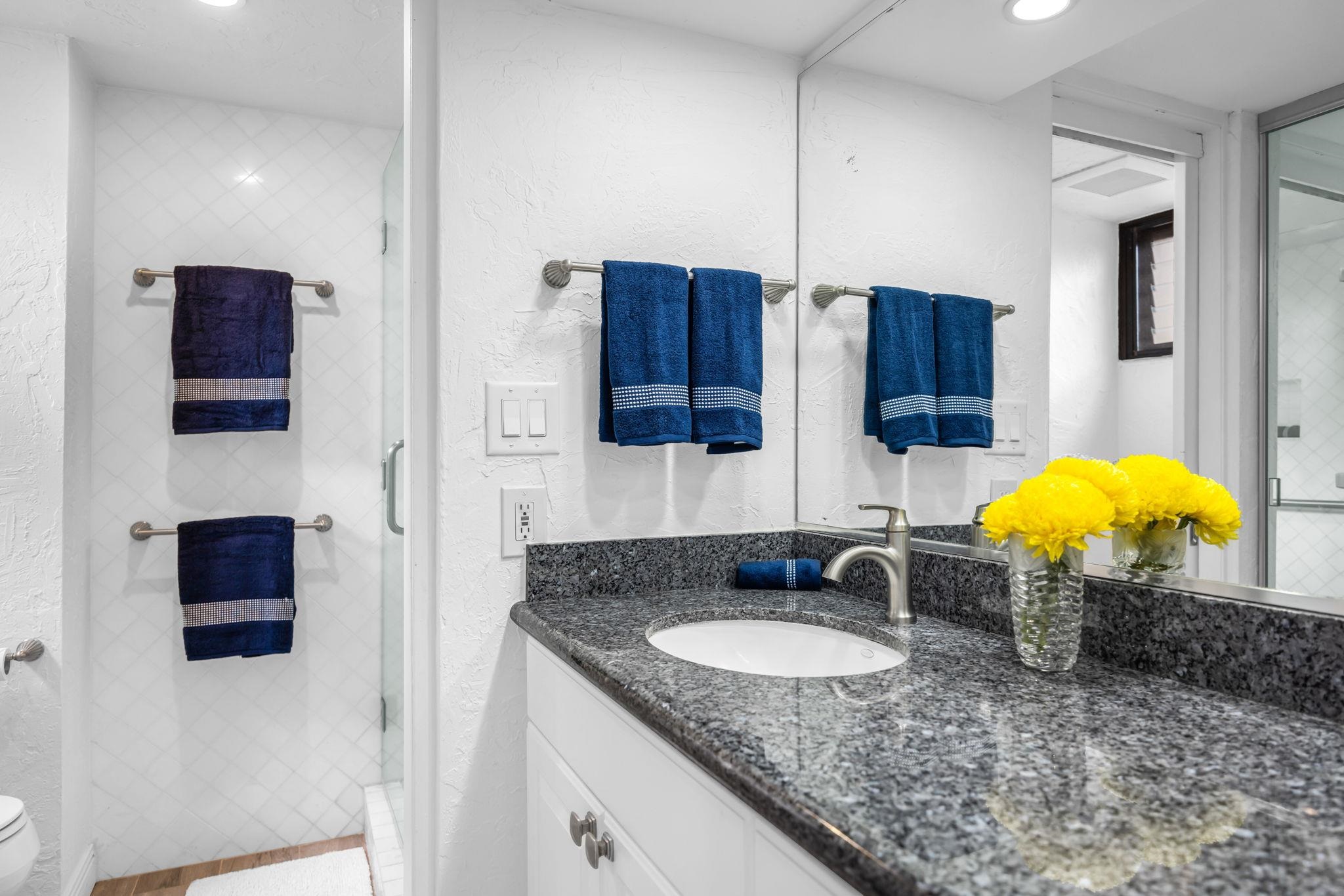 3543 Lower Honoapiilani Road, Unit F303 Lahaina, HI 96761 - Photo 5 of 20 a kitchen with a sink a stove and a microwave