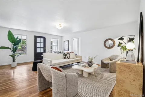 a living room with furniture and a table