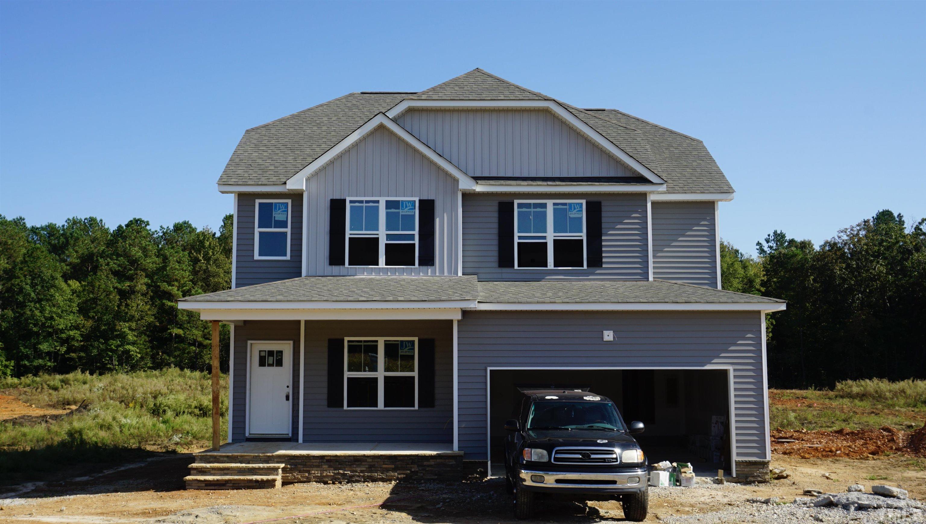 10519 West Old Spring Hope Road Spring Hope, NC 27882 - Photo 1 of 30 a front view of a house with a yard