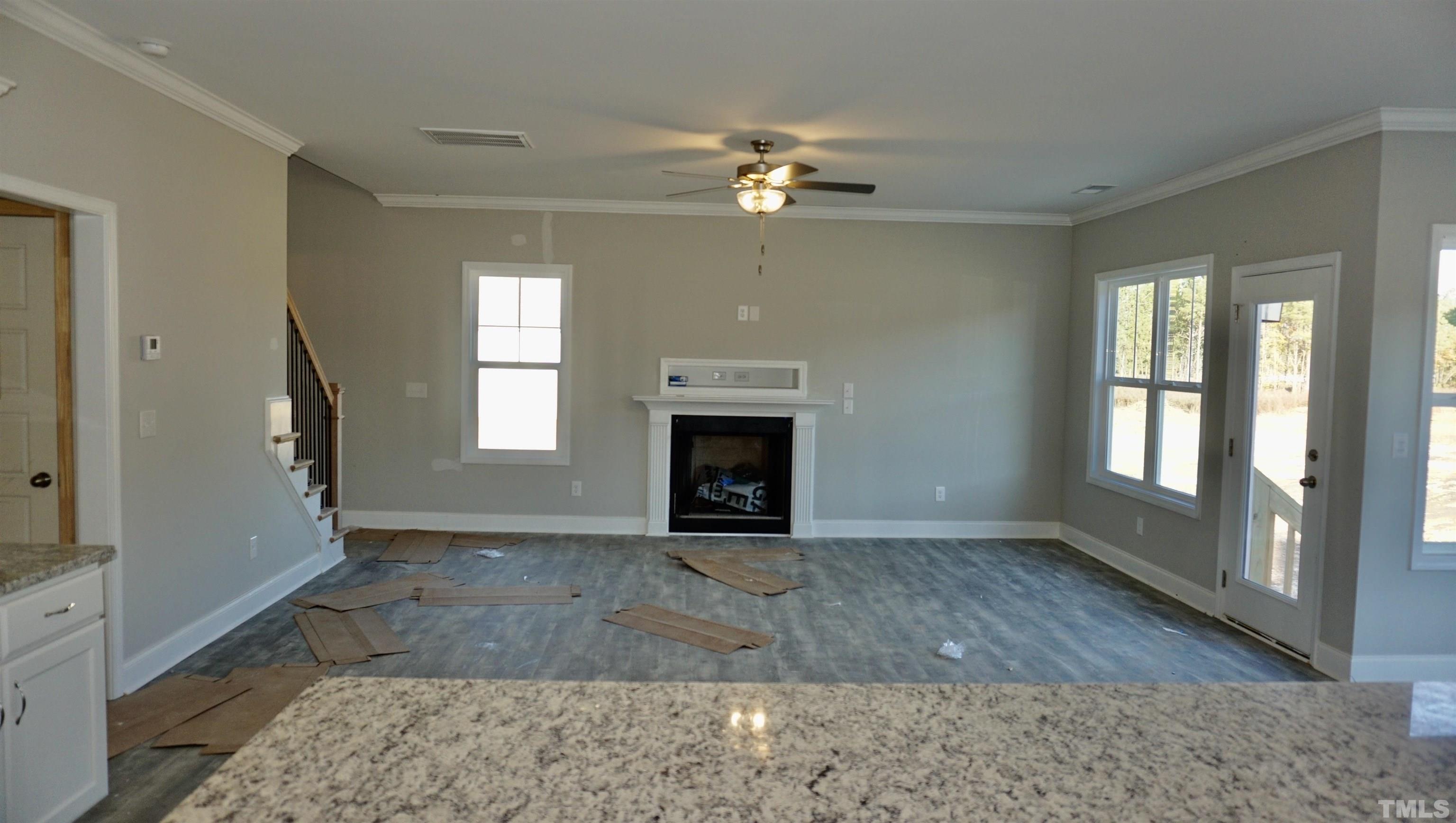 10519 West Old Spring Hope Road Spring Hope, NC 27882 - Photo 14 of 30 a view of an empty room with wooden floor and a window