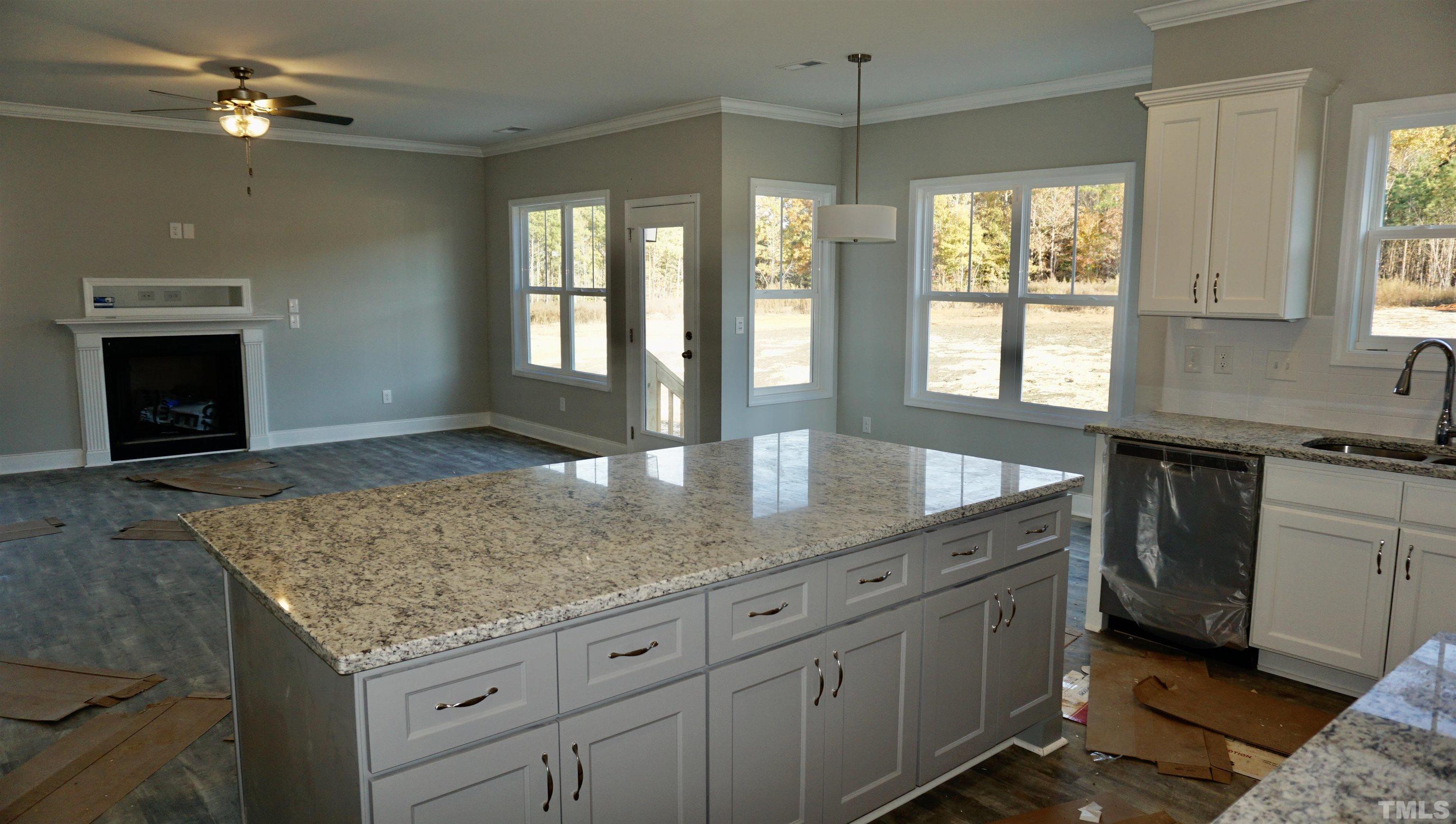 10519 West Old Spring Hope Road Spring Hope, NC 27882 - Photo 21 of 30 a kitchen with sink cabinets and chandelier