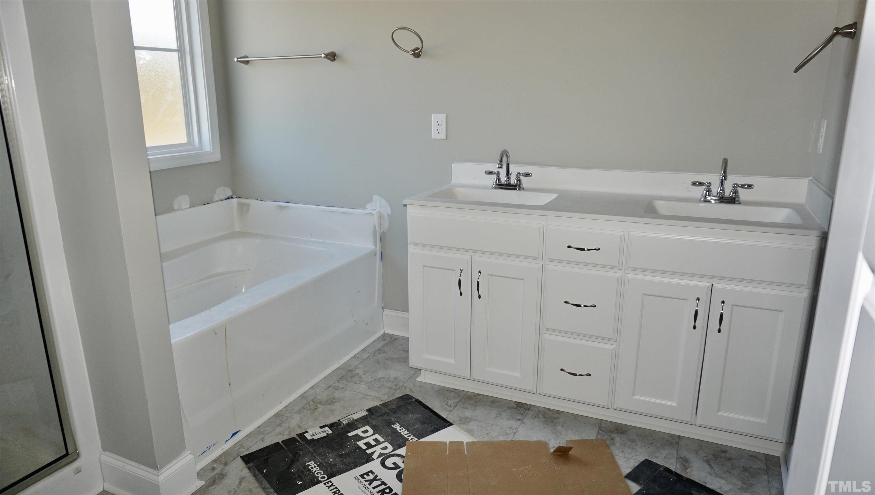 10519 West Old Spring Hope Road Spring Hope, NC 27882 - Photo 23 of 30 a bathroom with a sink and a bathtub