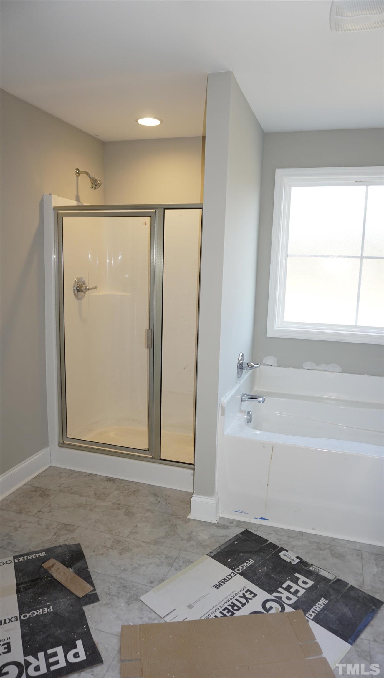 10519 West Old Spring Hope Road Spring Hope, NC 27882 - Photo 26 of 30 a bathroom with a bathtub and a shower