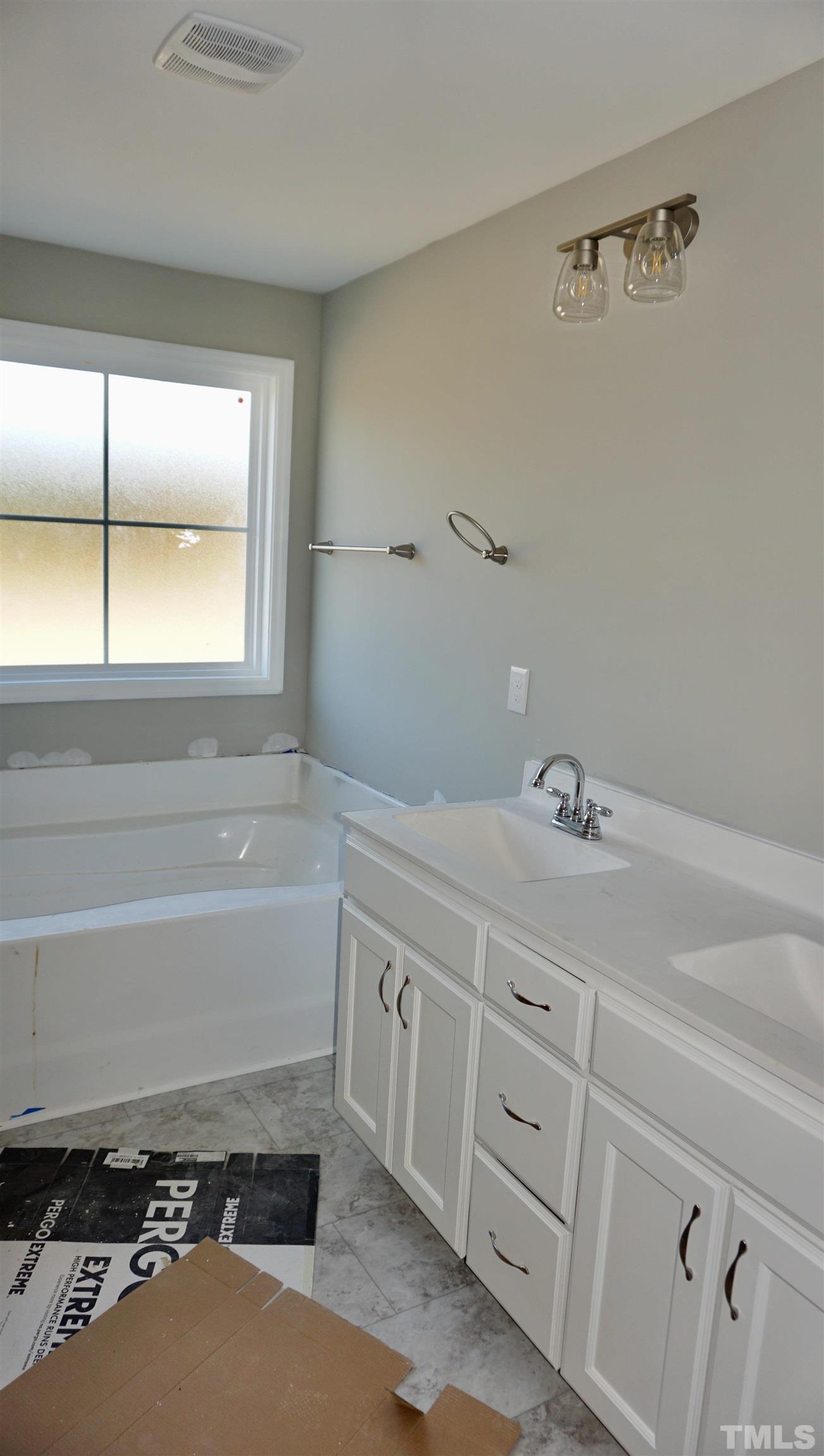 10519 West Old Spring Hope Road Spring Hope, NC 27882 - Photo 27 of 30 a bathroom with a sink and a bathtub