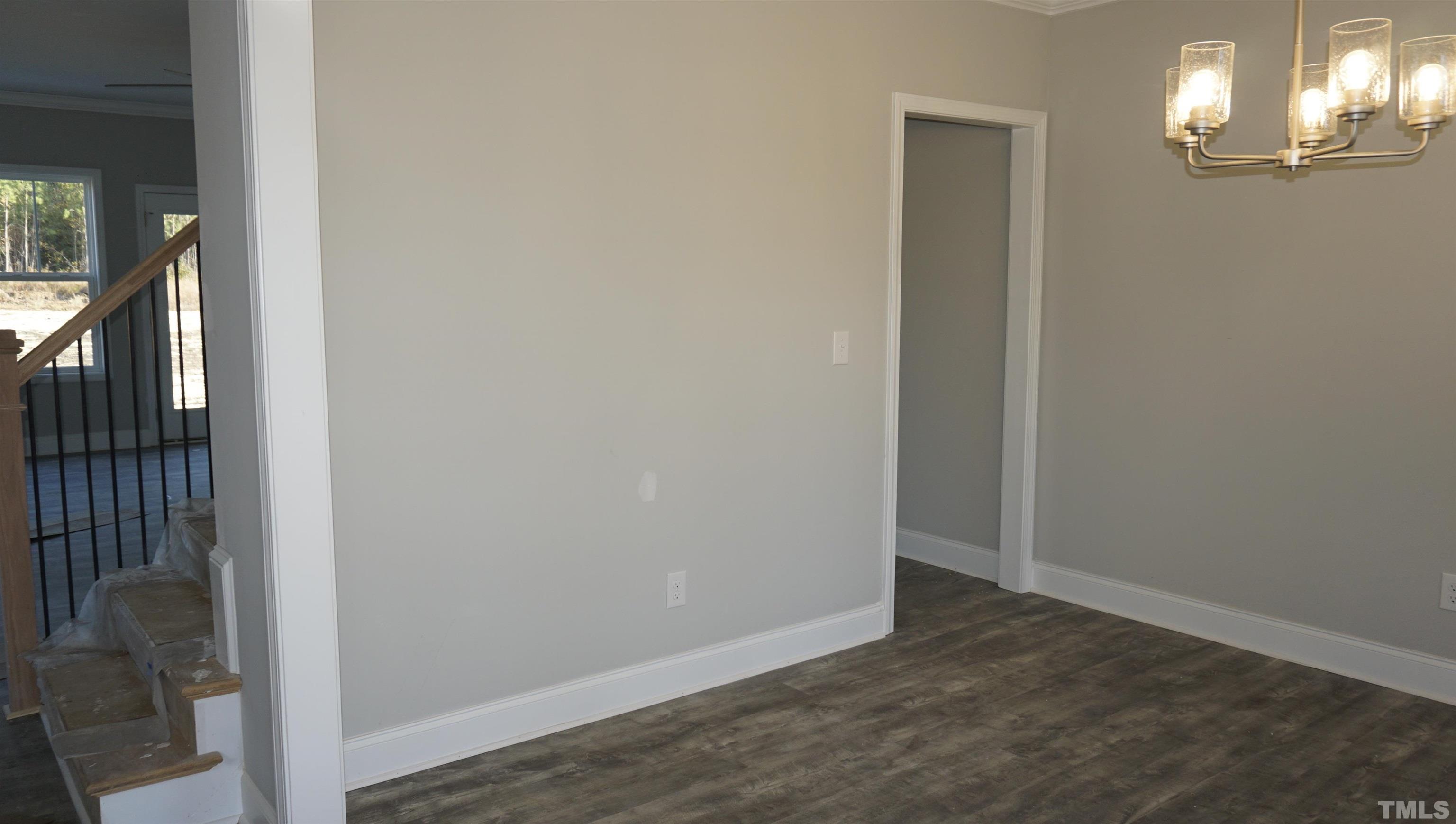 10519 West Old Spring Hope Road Spring Hope, NC 27882 - Photo 7 of 30 a view of a hallway with wooden floor and stairs