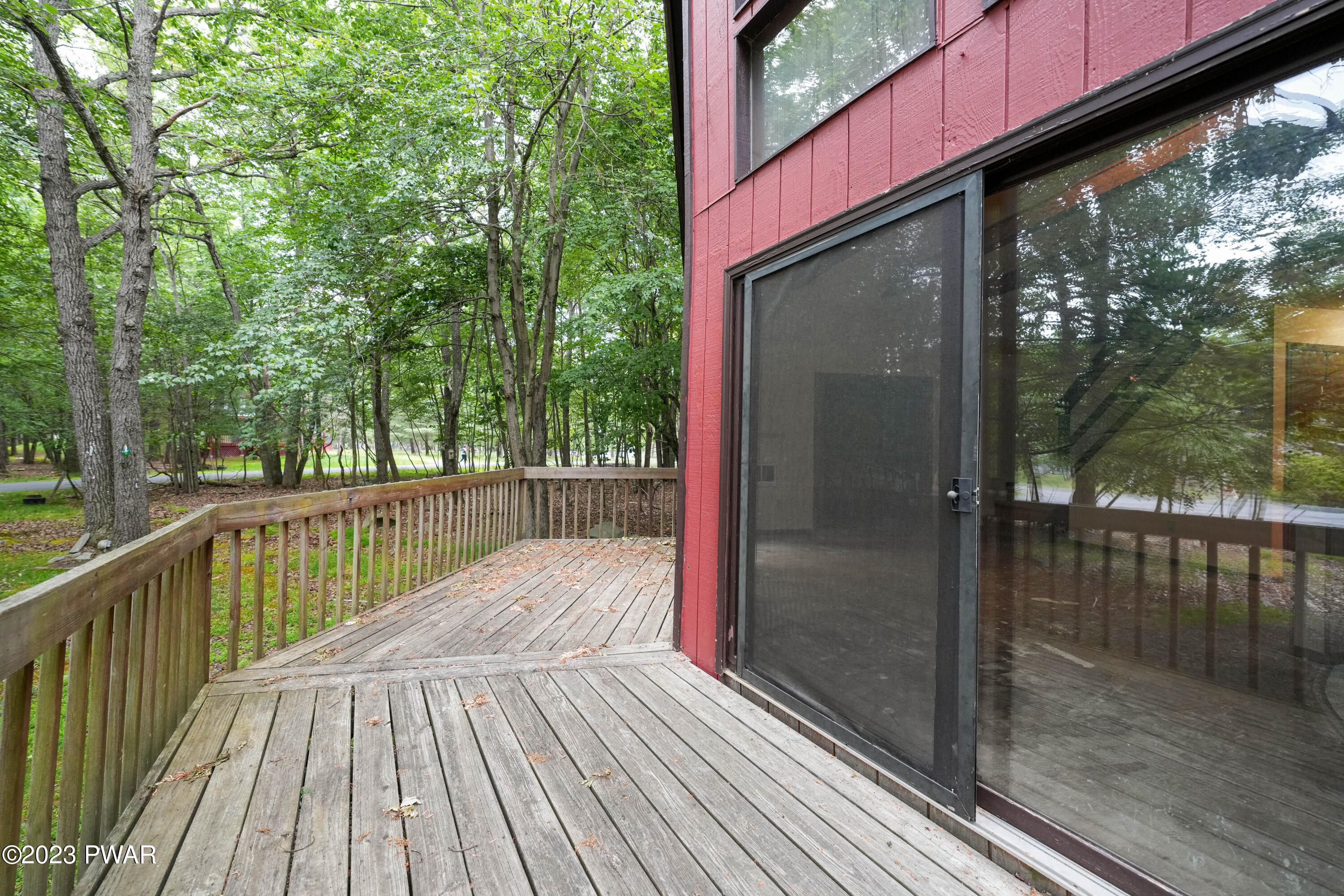 163 Roundhill Road Dingmans Ferry, PA 18328 - Photo 7 of 25 a view of balcony with wooden floor