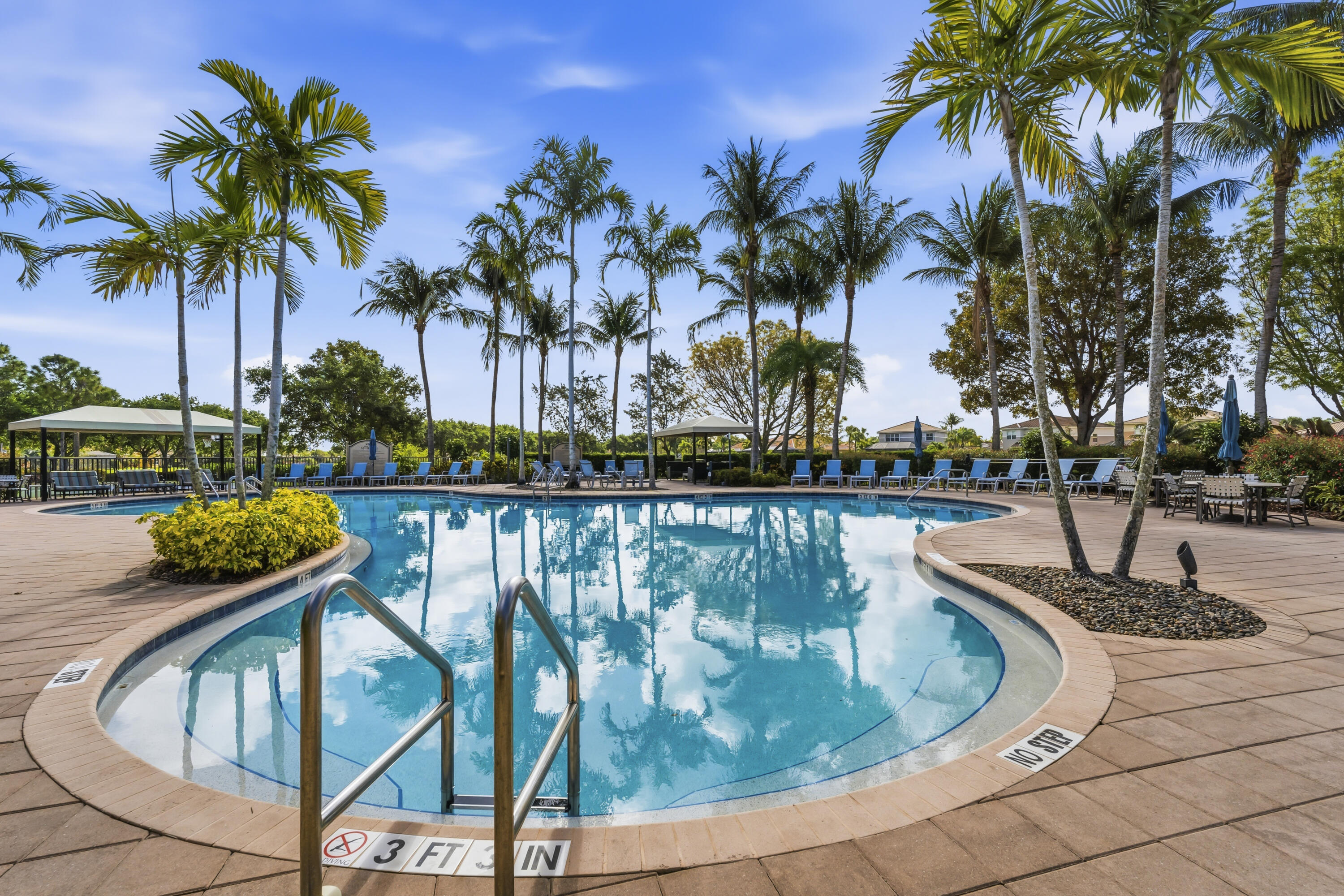 6513 Monterey Point, Unit 201 Naples, FL 34105 - Photo 32 of 35 42_the marbella lakes clubhouse - pool (