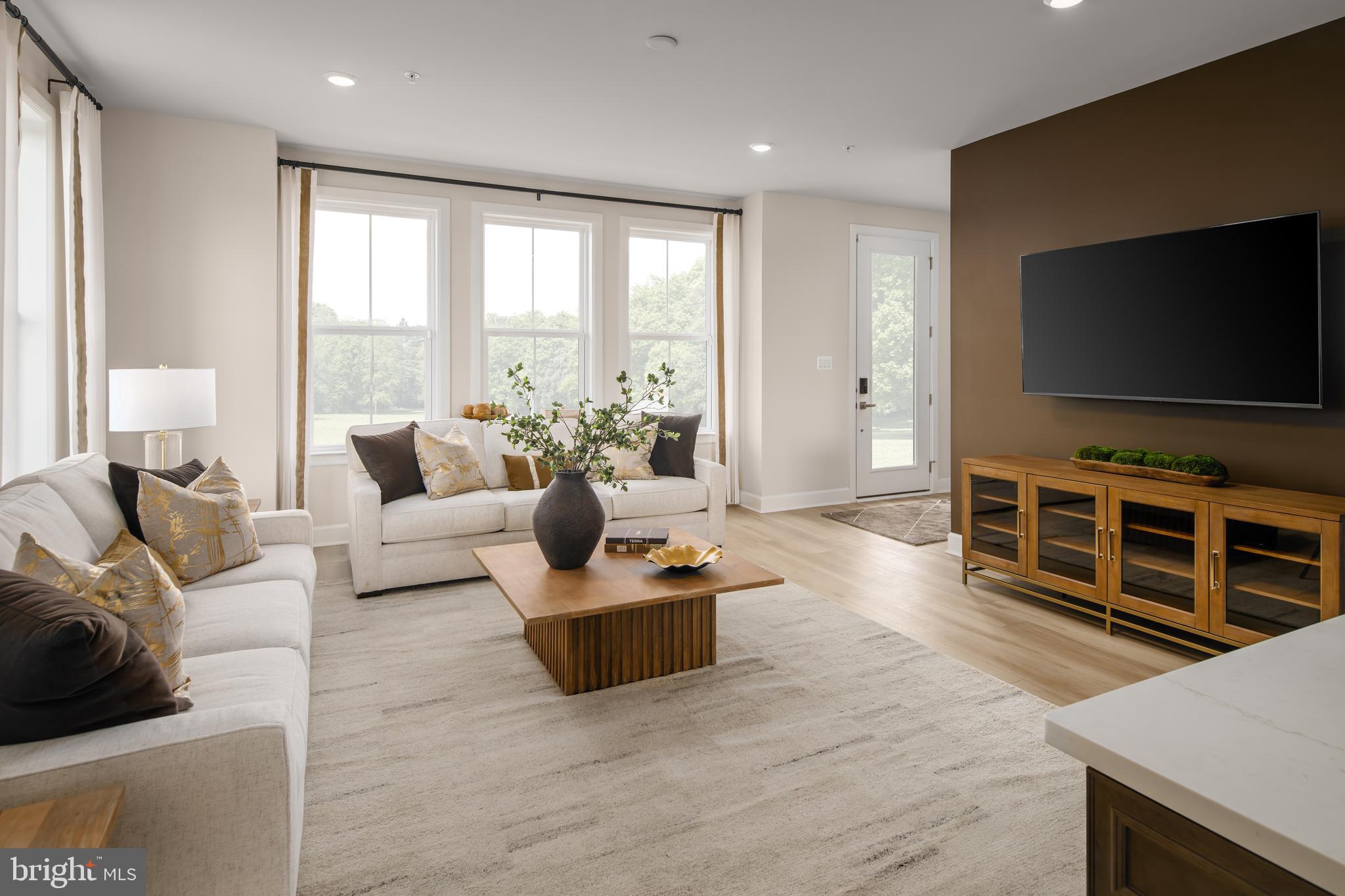 9404 Gerst Road Perry Hall, MD 21128 - Photo 2 of 22 a living room with furniture and a flat screen tv
