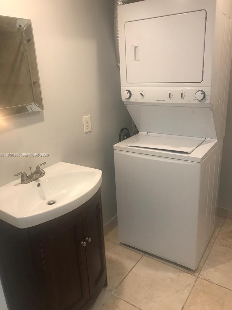 7570 Southwest 82nd Street, Unit F209 Miami, FL 33143 - Photo 13 of 13 a utility room with dryer and washer