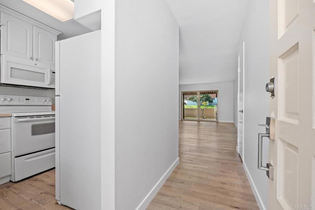 1741 Charleston Lane Encinitas, CA 92024 - Photo 4 of 18 a view of a hallway with washer and dryer