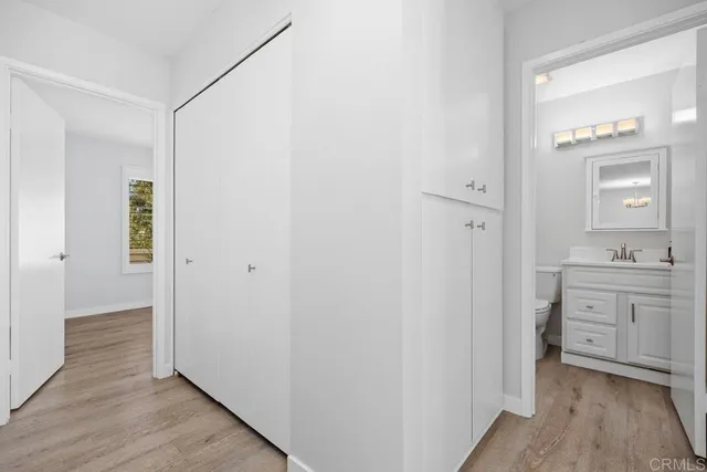 a bathroom with a sink a mirror and a vanity