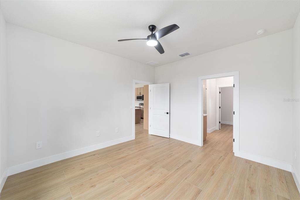 4380 Southwest 159th Court Ocala, FL 34481 - Photo 18 of 52 a view of empty room with wooden floor