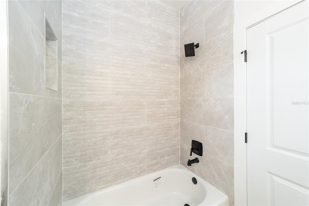 4380 Southwest 159th Court Ocala, FL 34481 - Photo 26 of 52 a bathroom with a bathtub