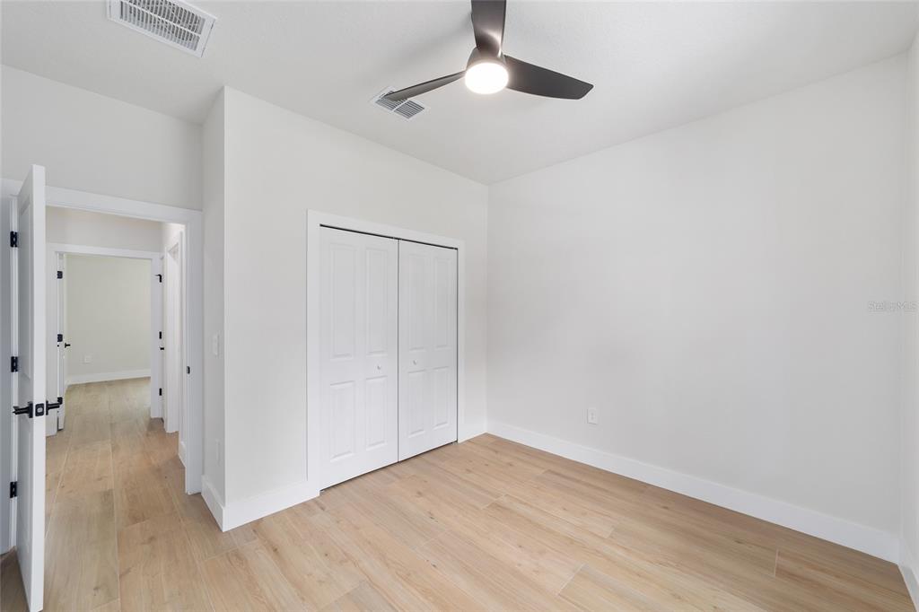 4380 Southwest 159th Court Ocala, FL 34481 - Photo 28 of 52 a view of empty room with wooden floor