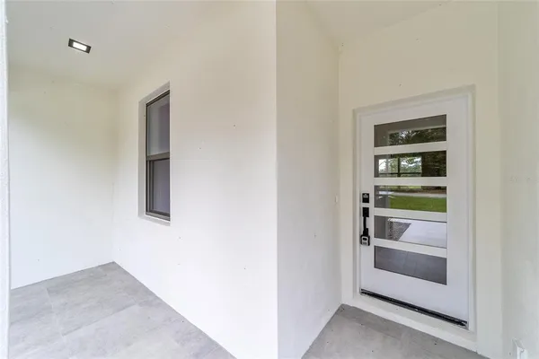 a view of an empty room and fire place