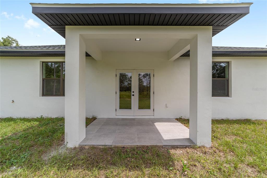 4380 Southwest 159th Court Ocala, FL 34481 - Photo 35 of 52 a front view of a house with a yard