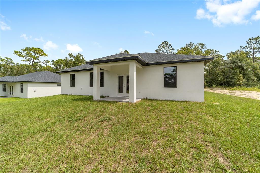 4380 Southwest 159th Court Ocala, FL 34481 - Photo 36 of 52 a view of a house with a yard