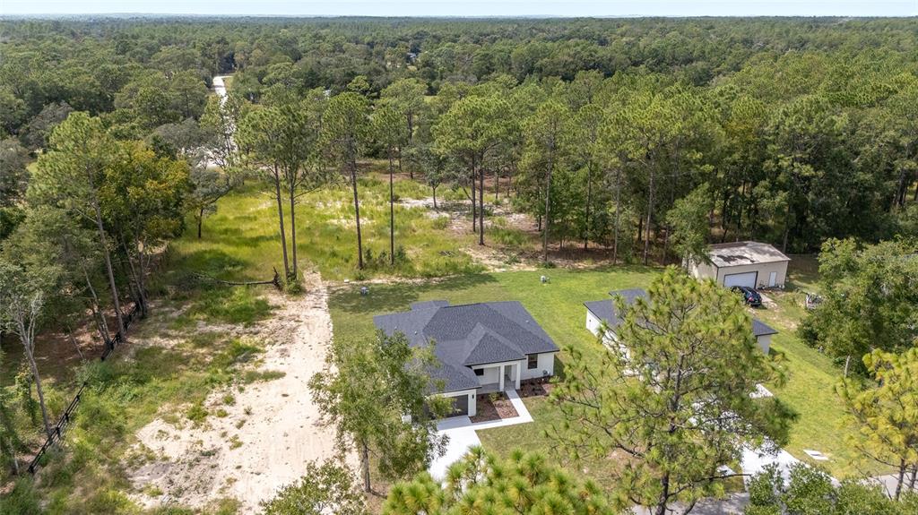 4380 Southwest 159th Court Ocala, FL 34481 - Photo 41 of 52 an aerial view of a house with yard swimming pool and outdoor seating