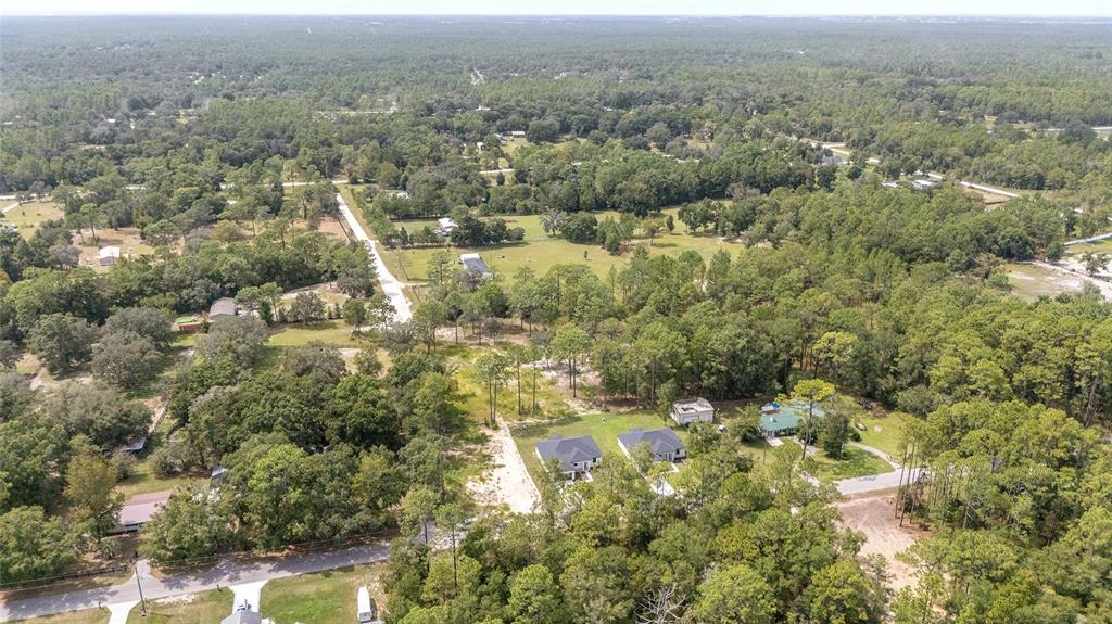4380 Southwest 159th Court Ocala, FL 34481 - Photo 45 of 52 an aerial view of residential houses with outdoor space and trees