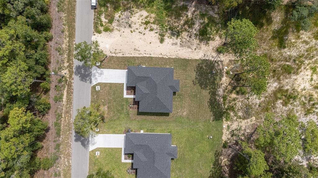4380 Southwest 159th Court Ocala, FL 34481 - Photo 46 of 52 an aerial view of a house with a yard