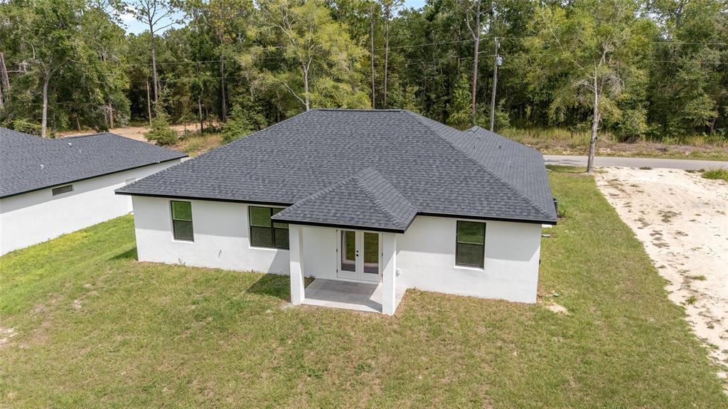 4380 Southwest 159th Court Ocala, FL 34481 - Photo 48 of 52 a house that has tree in front of it