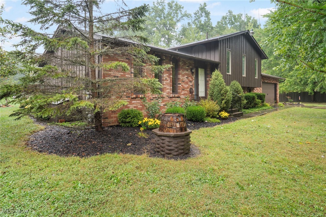 3417 Biltz Road Kent, OH 44240 - Photo 2 of 38 View of side of home with a lawn