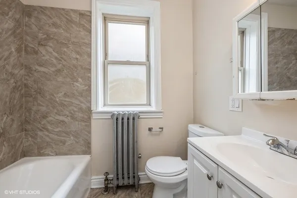a bathroom with a sink toilet and bathtub