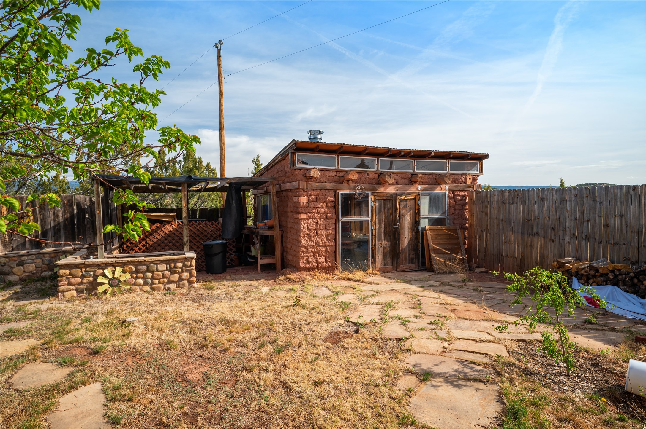 3-4 County Rd B41C San Jose, NM 87565 - Photo 21 of 41 Adobe outbuilding with attached potting and gardening areas.