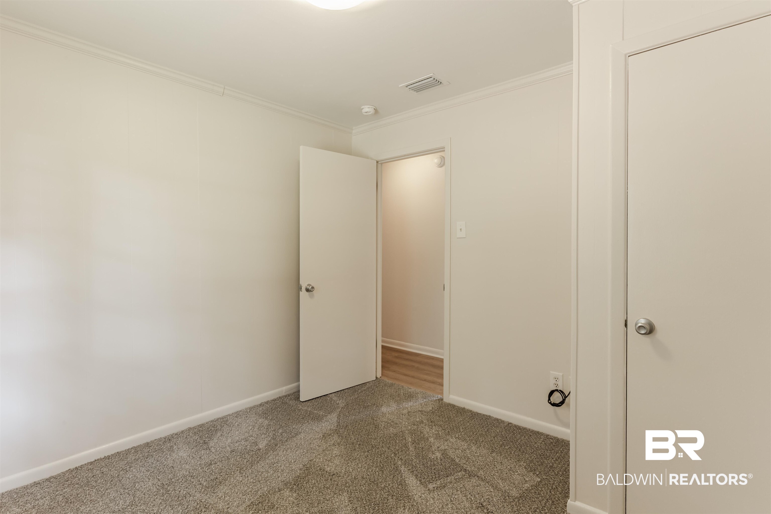 3970 Oak Ridge Avenue Mobile, AL 36619 - Photo 9 of 28 Carpeted empty room with ornamental molding