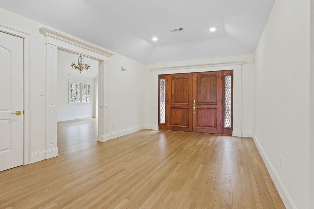 80 Doublet Hill Road Weston, MA 02493 - Photo 5 of 38 wooden floor in an empty room with a window