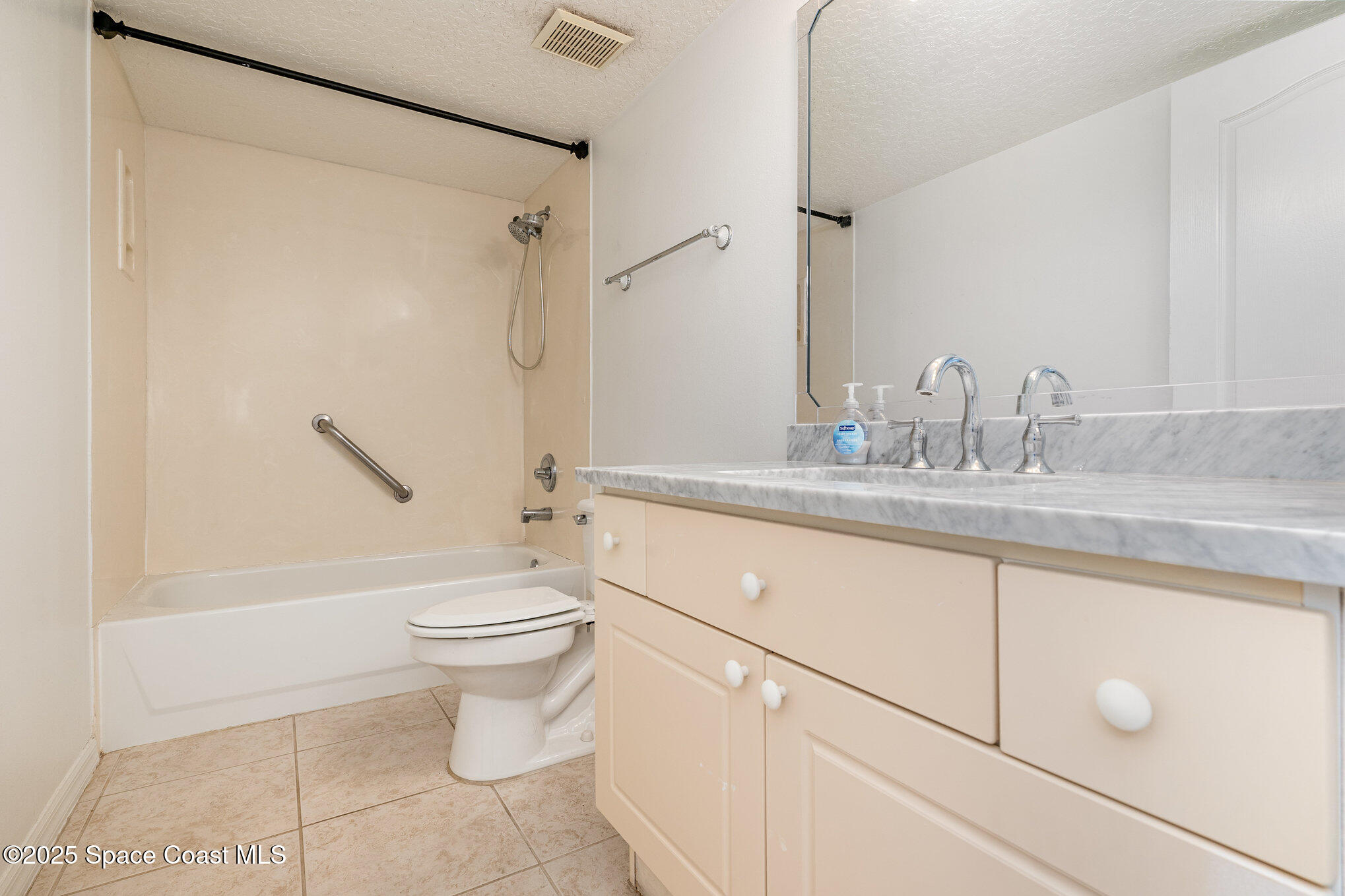 1575 North Hwy A1A, Unit 613 Indialantic, FL 32903 - Photo 13 of 23 a bathroom with a sink a toilet and shower