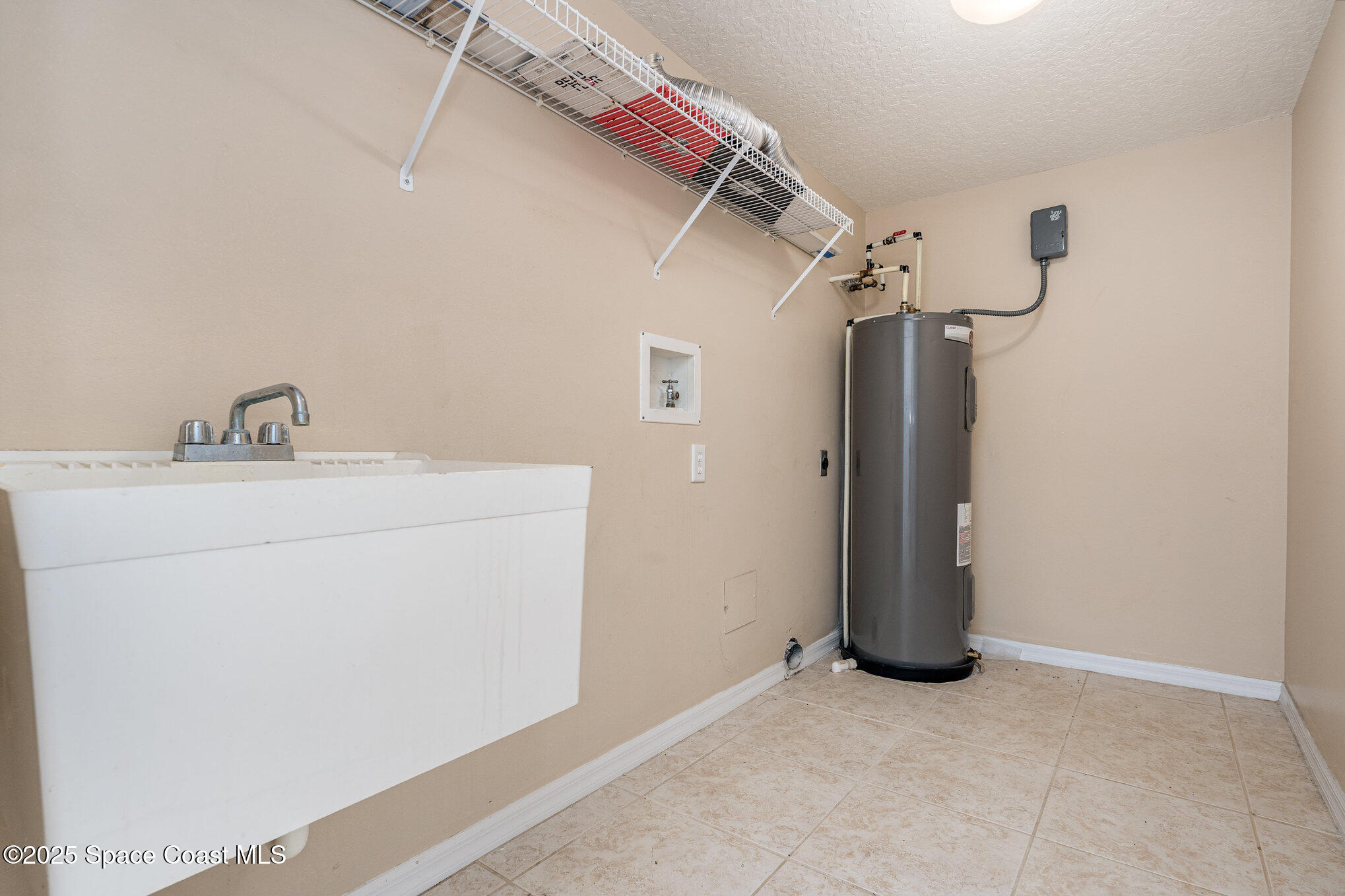 1575 North Hwy A1A, Unit 613 Indialantic, FL 32903 - Photo 20 of 23 a utility room with dryer and washer