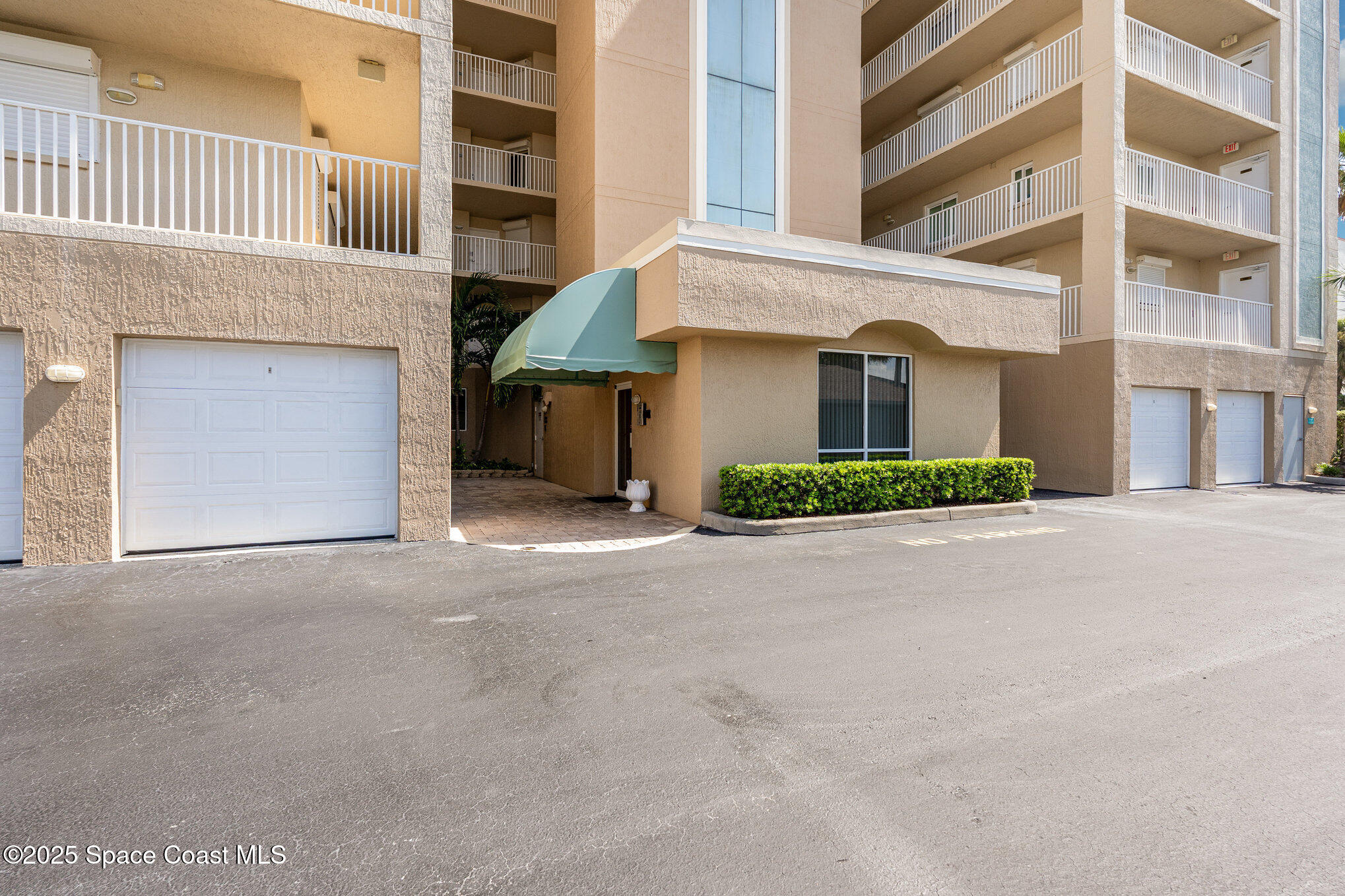 1575 North Hwy A1A, Unit 613 Indialantic, FL 32903 - Photo 2 of 23 a front view of a building with a street