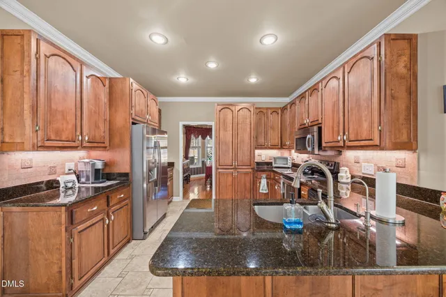 a very nice looking dining room with kitchen island granite countertop furniture and a kitchen view