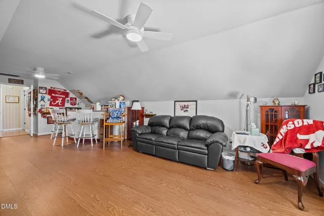 a bathroom with a toilet and a shower curtain