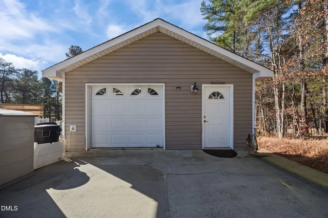 an aerial view of a house with outdoor space