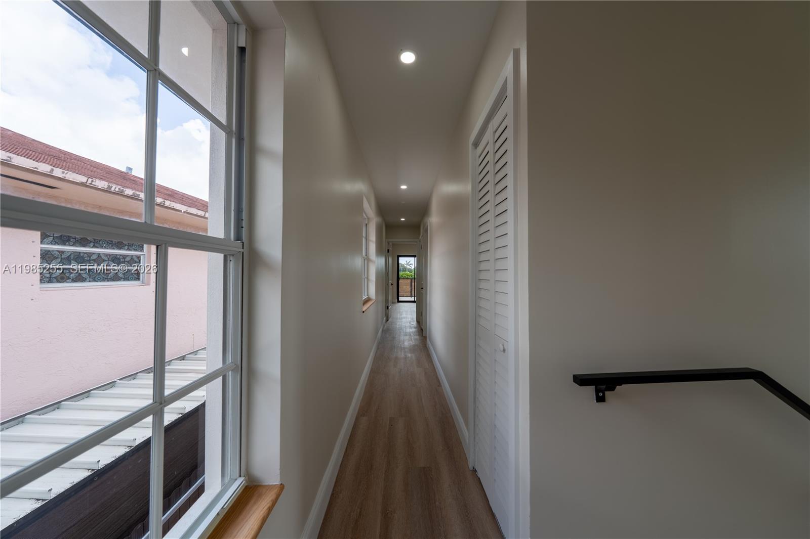 370 Flagami Boulevard Miami, FL 33144 - Photo 23 of 67 a view of a hallway with wooden floor and staircase
