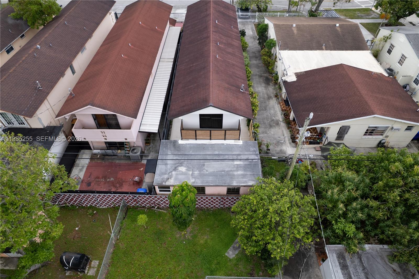 370 Flagami Boulevard Miami, FL 33144 - Photo 55 of 57 an aerial view of a house with swimming pool and a yard