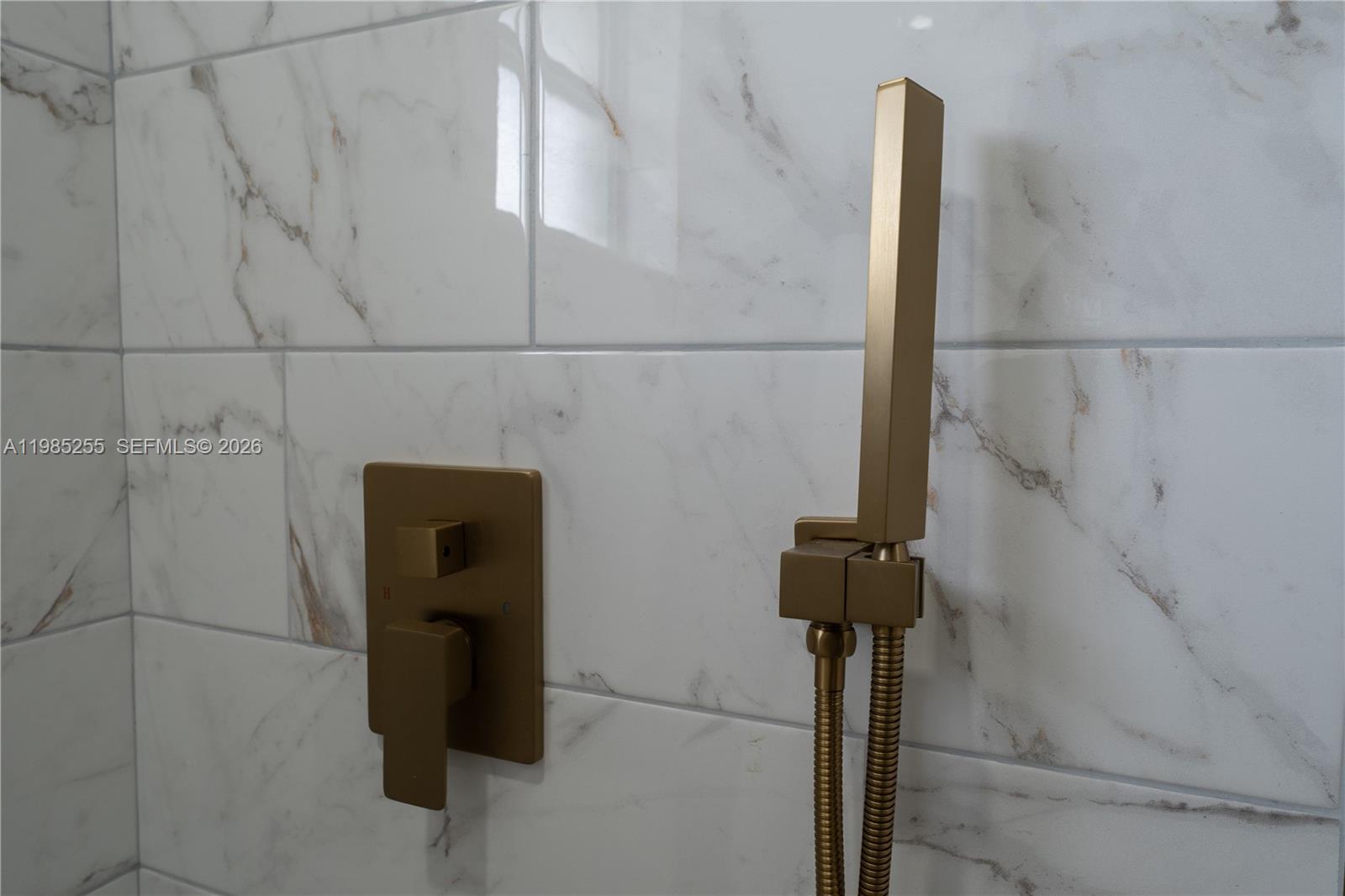 370 Flagami Boulevard Miami, FL 33144 - Photo 60 of 67 a close view of a shower in a bathroom