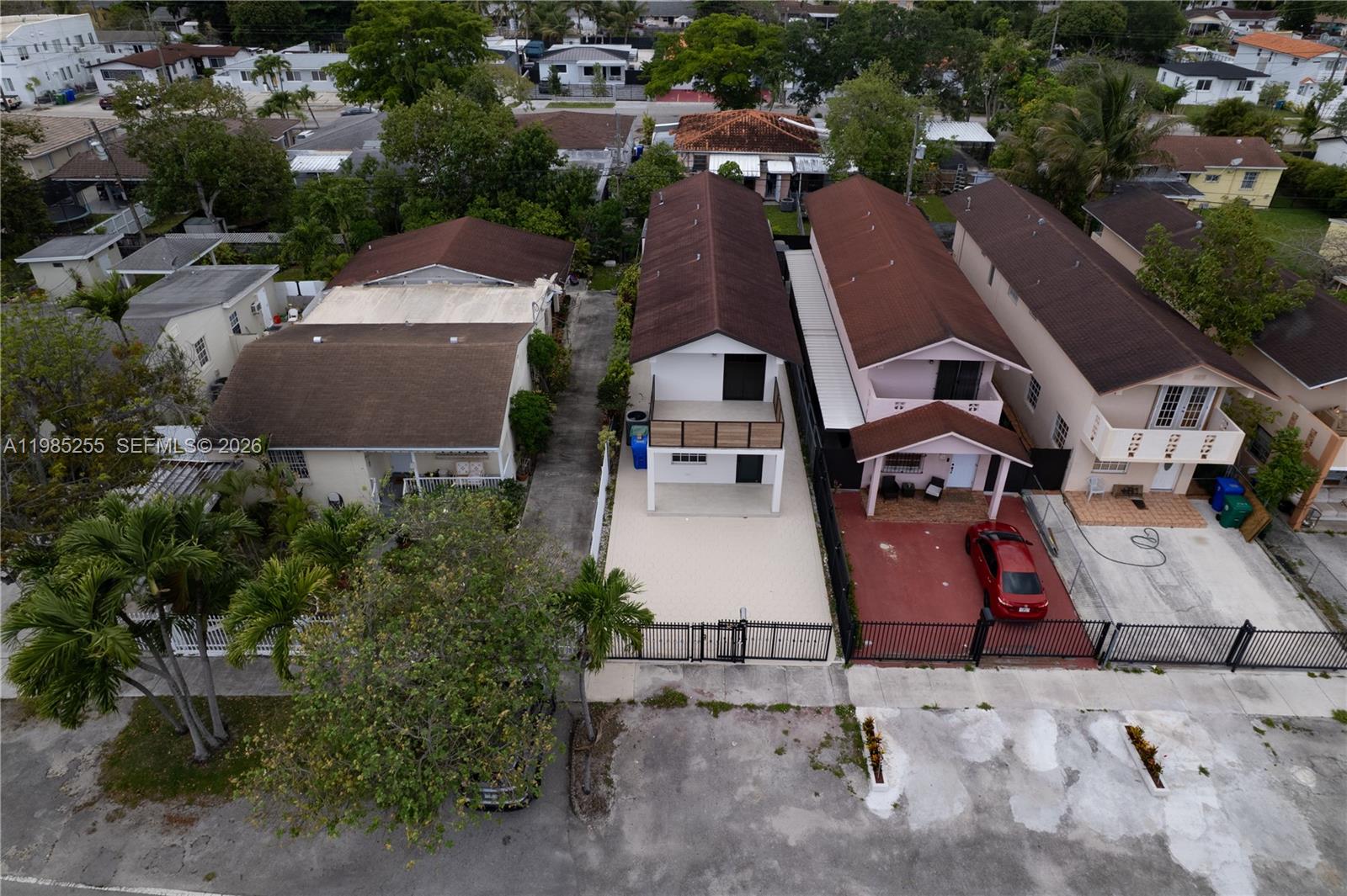 370 Flagami Boulevard Miami, FL 33144 - Photo 64 of 67 an aerial view of a house with swimming pool and large trees